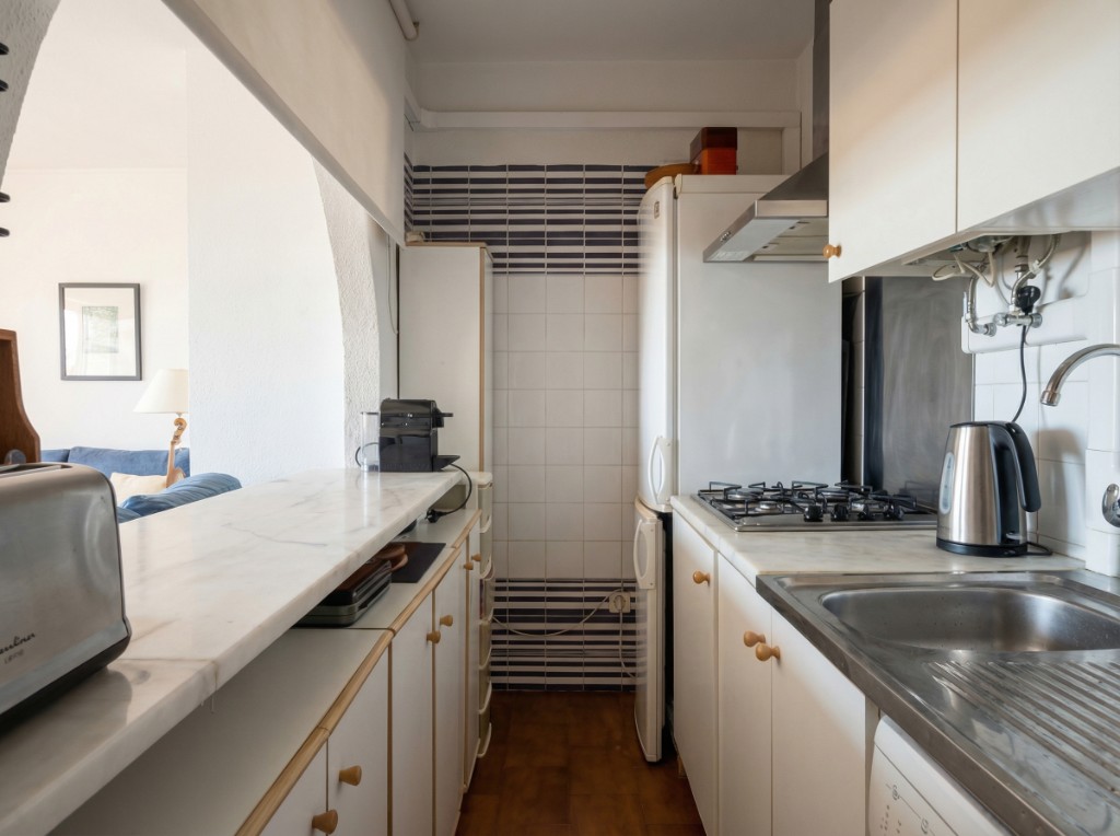 Kitchen photo after AI enhancement with cleaner whites and balanced light