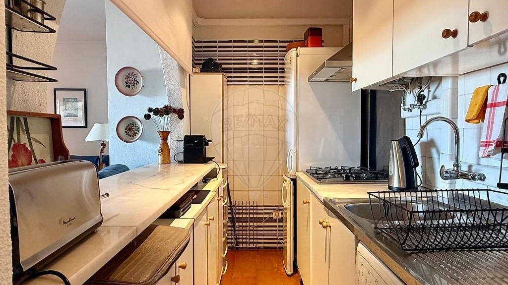 Kitchen photo before AI enhancement with warm cast and cluttered look